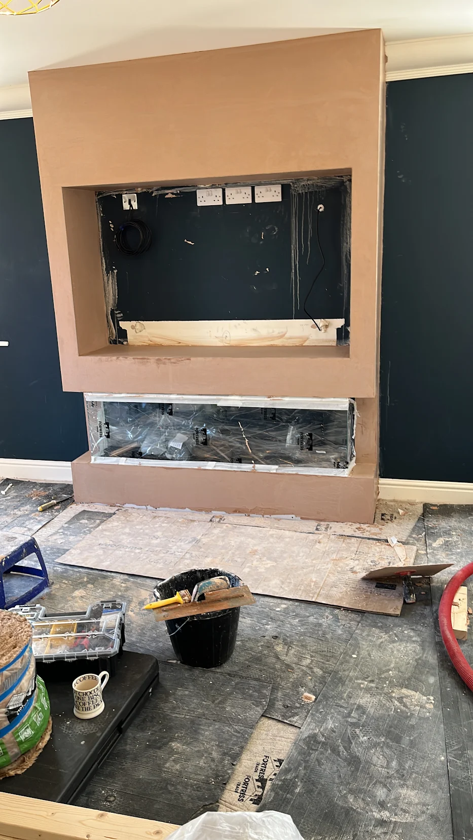 Media wall mid-build with plastered carcass and recess prepared for TV