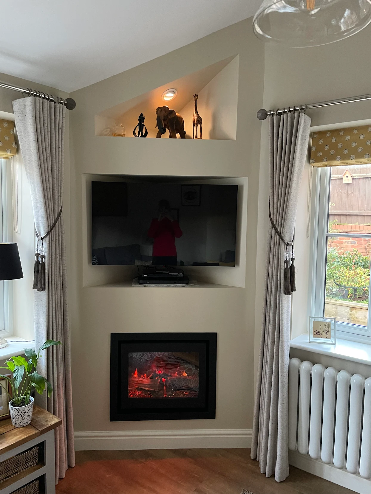Bespoke alcove TV recess with display niche above and inset media fire below, fitted by Warwickshire Media Walls for Michael Wright
